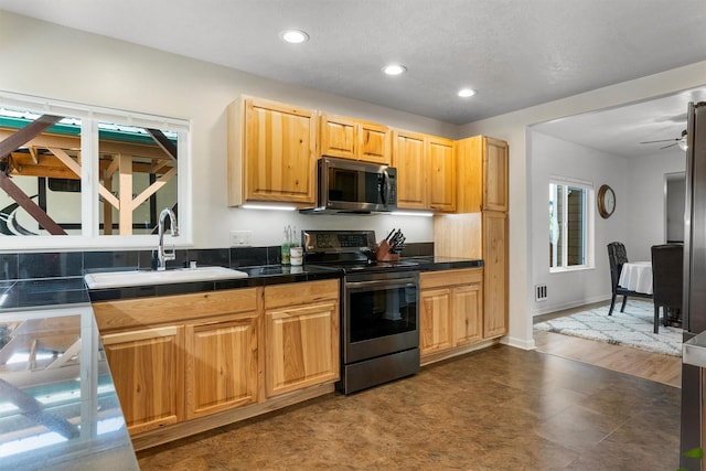505 N 4th St, Hamilton, MT 59840 - kitchen featuring appliances with stainless steel finishes, a sink, recessed lighting, a ceiling fan, and baseboards