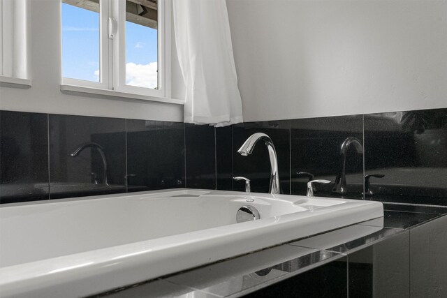 505 N 4th St, Hamilton, MT 59840 - full bathroom featuring decorative backsplash and a tub to relax in