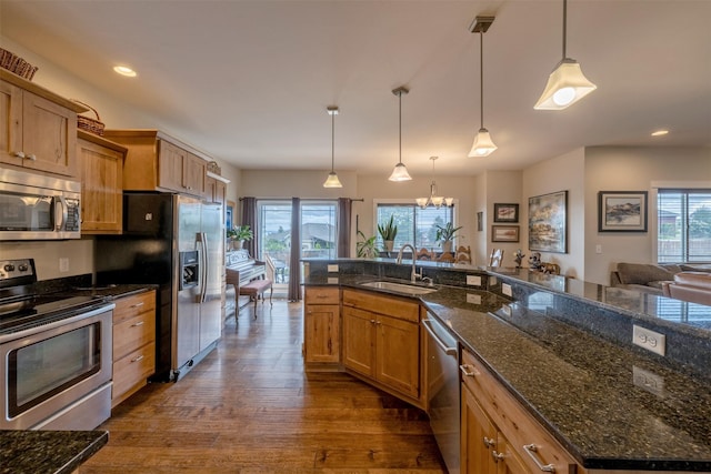 4288 Iverson Rd, Helena, MT 59602 - kitchen featuring appliances with stainless steel finishes, a sink, dark wood finished floors, a chandelier, and recessed lighting
