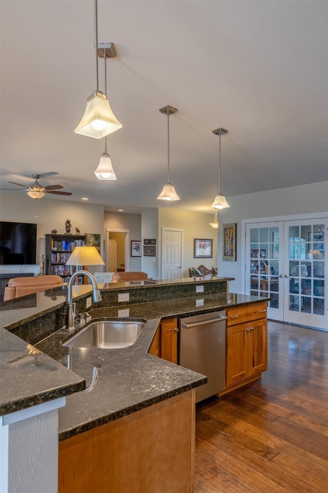 4288 Iverson Rd, Helena, MT 59602 - kitchen with stainless steel dishwasher, a sink, brown cabinets, open floor plan, and french doors