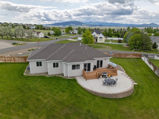 4288 Iverson Rd, Helena, MT 59602 - back of property featuring a deck with mountain view and a shingled roof