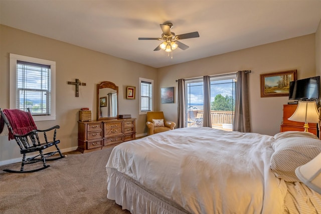 4288 Iverson Rd, Helena, MT 59602 - carpeted bedroom with access to outside, multiple windows, baseboards, and ceiling fan
