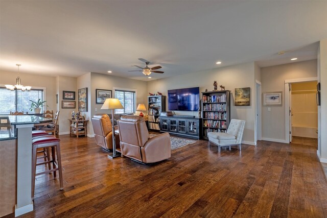 4288 Iverson Rd, Helena, MT 59602 - living area featuring dark wood-style floors, plenty of natural light, a chandelier, ceiling fan, and recessed lighting
