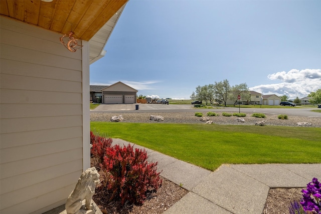 4288 Iverson Rd, Helena, MT 59602 - view of grassy yard featuring a garage