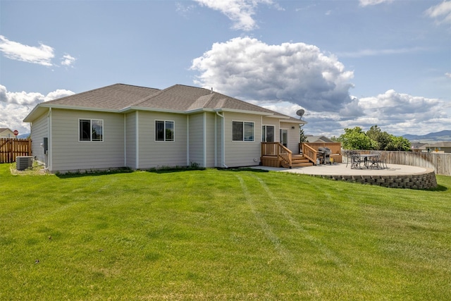 4288 Iverson Rd, Helena, MT 59602 - back of property with central AC unit, a patio, and roof with shingles