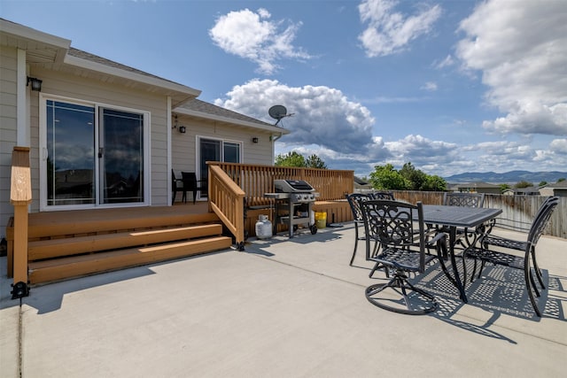 4288 Iverson Rd, Helena, MT 59602 - view of patio / terrace with outdoor dining area, a deck with mountain view, and area for grilling