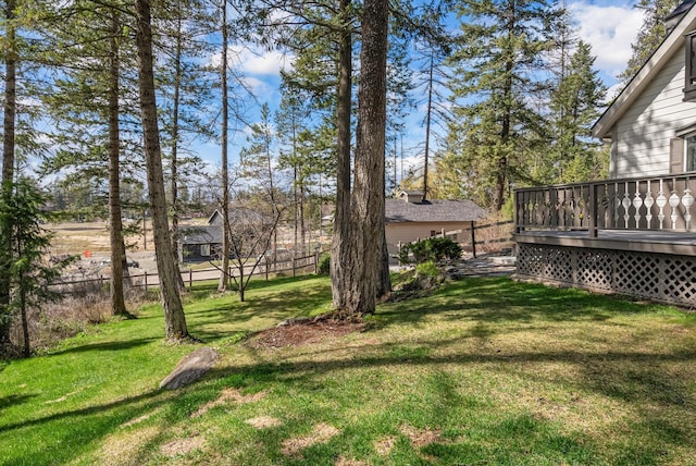 343 Deer Trl, Whitefish, MT 59937 - view of grassy yard with a wooden deck
