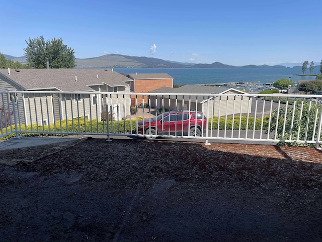 12 Country Club Dr Unit 16, Polson, MT 59860 - view of yard with a mountain view and a balcony