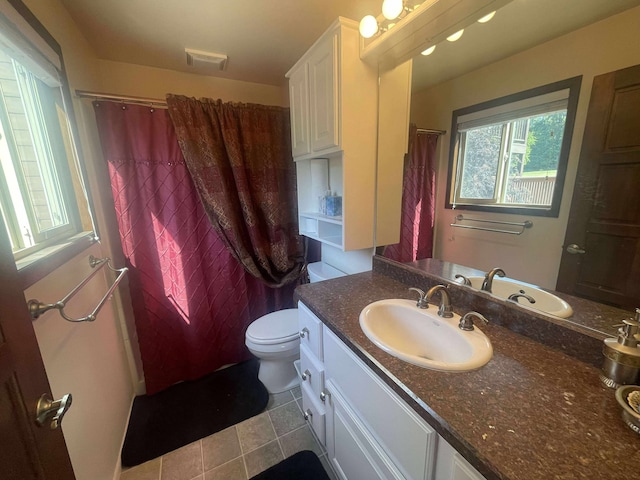 12 Country Club Dr Unit 16, Polson, MT 59860 - bathroom with vanity, toilet, and tile patterned flooring