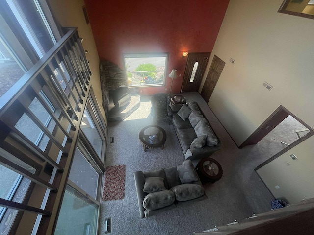 12 Country Club Dr Unit 16, Polson, MT 59860 - unfurnished living room featuring a high ceiling and carpet flooring