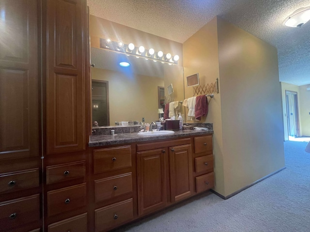 12 Country Club Dr Unit 16, Polson, MT 59860 - bathroom with a textured ceiling and double vanity