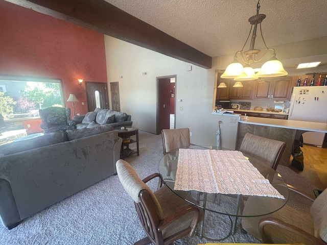 12 Country Club Dr Unit 16, Polson, MT 59860 - dining area with light carpet, a chandelier, and a textured ceiling