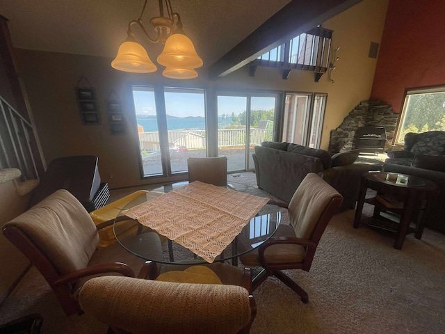 12 Country Club Dr Unit 16, Polson, MT 59860 - dining area featuring vaulted ceiling and carpet flooring
