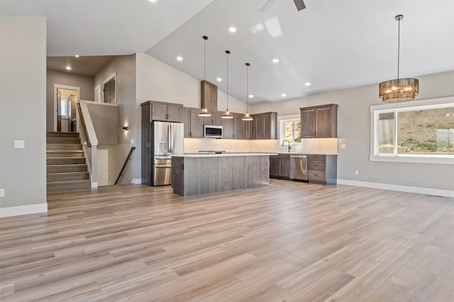 4337 Christian Dr, Missoula, MT 59803 - kitchen with stainless steel appliances, open floor plan, light countertops, a center island, and recessed lighting