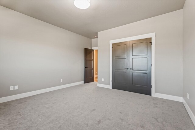 4337 Christian Dr, Missoula, MT 59803 - unfurnished bedroom featuring baseboards, carpet, and a closet