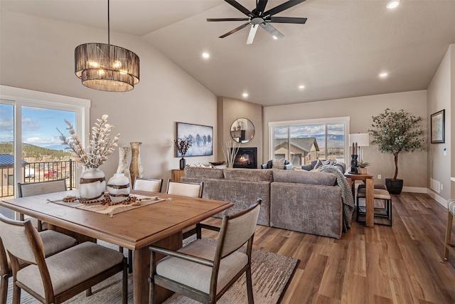 4337 Christian Dr, Missoula, MT 59803 - dining space featuring vaulted ceiling, recessed lighting, ceiling fan, wood finished floors, and baseboards