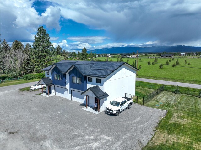 220 Columbia Meadows Dr, Columbia Falls, MT 59912 - aerial view of property and surrounding area with mountains