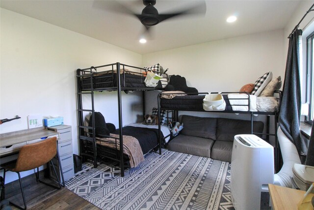 220 Columbia Meadows Dr, Columbia Falls, MT 59912 - bedroom featuring wood finished floors, a desk, recessed lighting, and a ceiling fan
