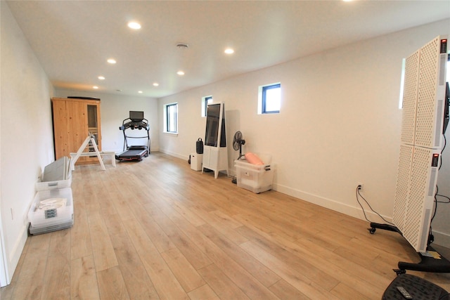 224 Columbia Meadows Dr, Columbia Falls, MT 59912 - workout room with recessed lighting, a heating unit, light wood-style flooring, and baseboards