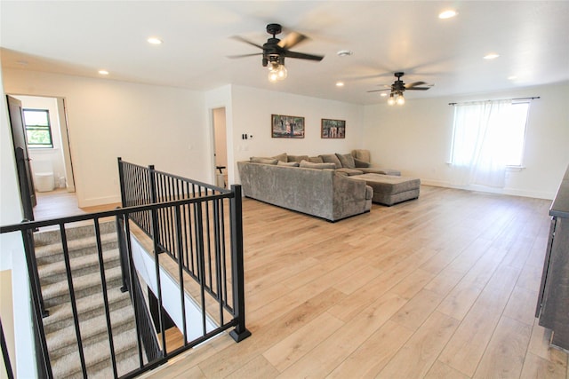 224 Columbia Meadows Dr, Columbia Falls, MT 59912 - living room featuring ceiling fan, recessed lighting, light wood finished floors, and baseboards