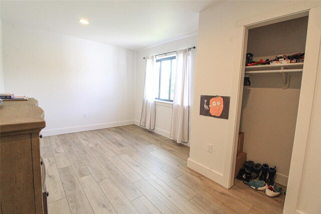 224 Columbia Meadows Dr, Columbia Falls, MT 59912 - unfurnished bedroom featuring light wood-style flooring, baseboards, and recessed lighting