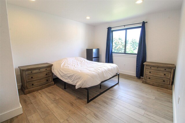 224 Columbia Meadows Dr, Columbia Falls, MT 59912 - bedroom featuring light wood-style flooring, recessed lighting, and baseboards