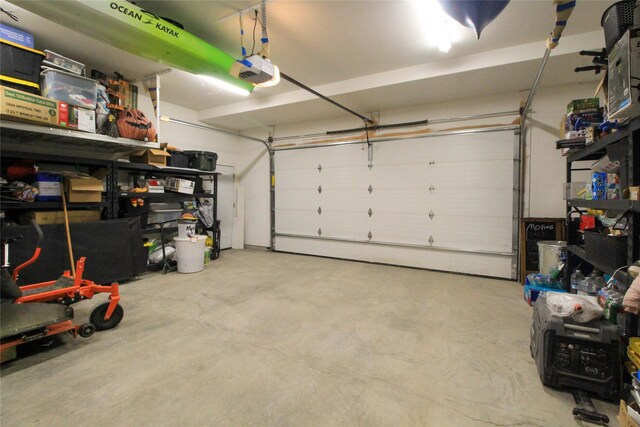 224 Columbia Meadows Dr, Columbia Falls, MT 59912 - garage featuring a garage door opener