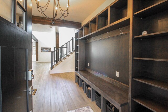 224 Columbia Meadows Dr, Columbia Falls, MT 59912 - mudroom with a chandelier, light wood-type flooring, and baseboards