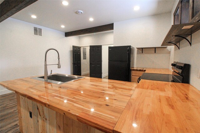 224 Columbia Meadows Dr, Columbia Falls, MT 59912 - kitchen with butcher block countertops, freestanding refrigerator, range with electric stovetop, a sink, and open shelves