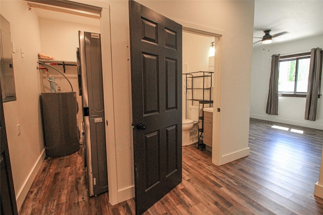 224 Columbia Meadows Dr, Columbia Falls, MT 59912 - hallway with dark wood-style flooring, baseboards, and water heater