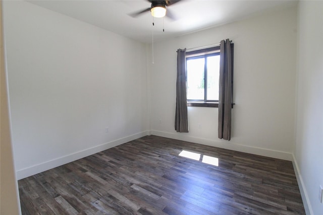 224 Columbia Meadows Dr, Columbia Falls, MT 59912 - spare room featuring dark wood finished floors, ceiling fan, and baseboards