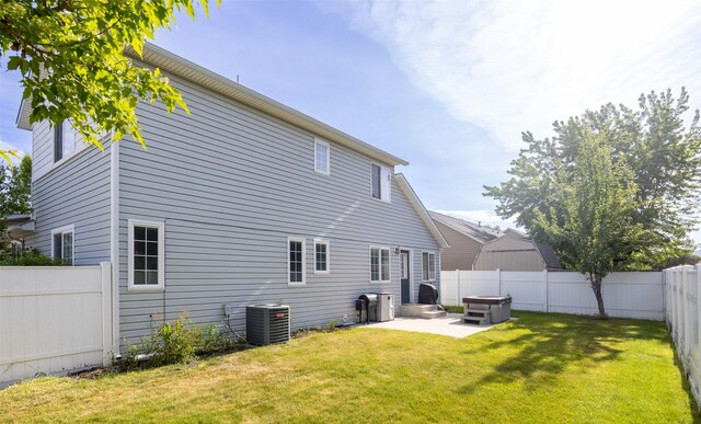 2322 Mary Jane Blvd, Missoula, MT 59808 - rear view of property featuring central air condition unit and a patio