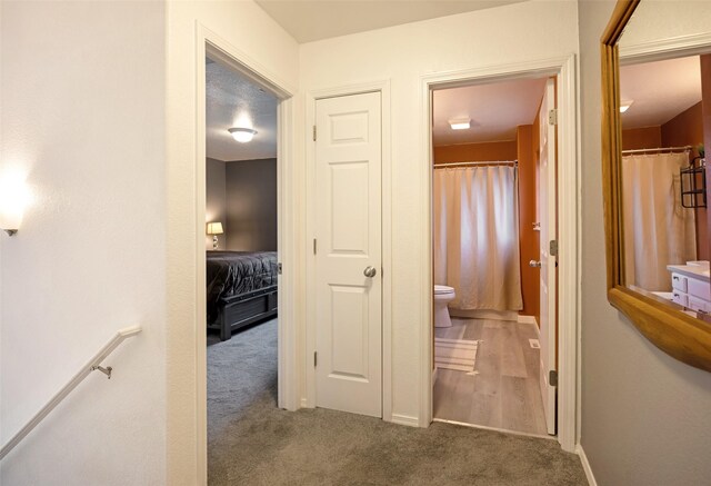 2322 Mary Jane Blvd, Missoula, MT 59808 - hallway with carpet, baseboards, and an upstairs landing