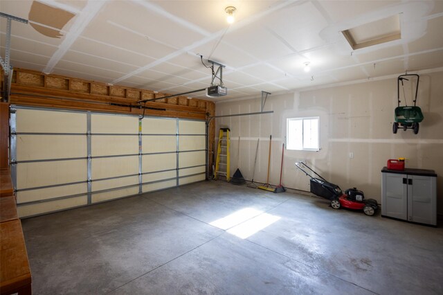 2322 Mary Jane Blvd, Missoula, MT 59808 - garage featuring a garage door opener