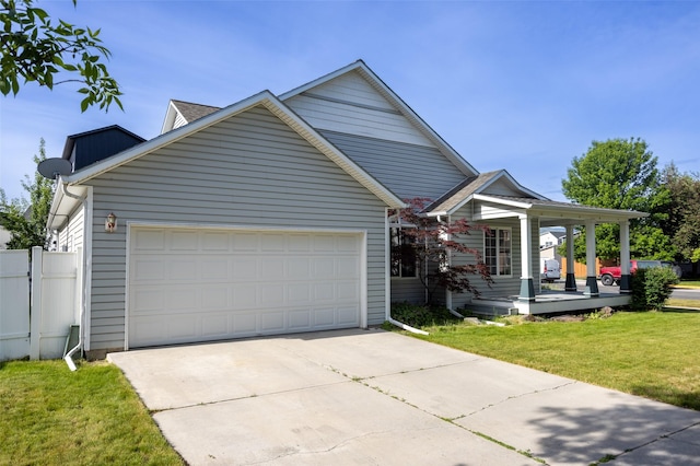 2322 Mary Jane Blvd, Missoula, MT 59808 - traditional home featuring a garage, concrete driveway, and covered porch