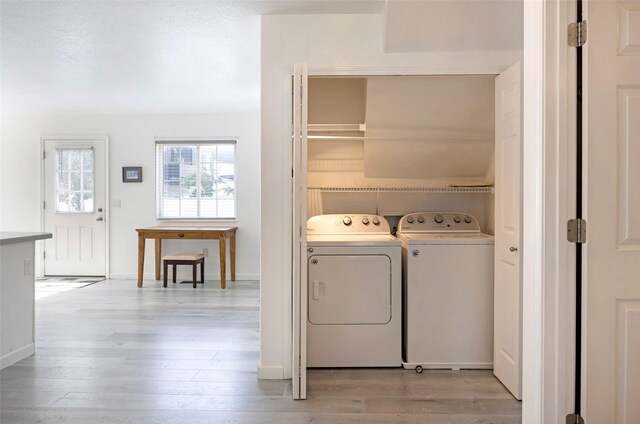 2322 Mary Jane Blvd, Missoula, MT 59808 - washroom featuring independent washer and dryer, light wood-style floors, and baseboards