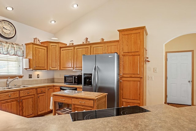 1 Cherry Ct, Clancy, MT 59634 - kitchen with black appliances, lofted ceiling, arched walkways, recessed lighting, and light countertops