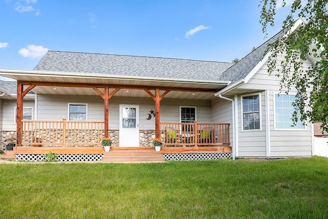 1 Cherry Ct, Clancy, MT 59634 - rear view of house with covered porch, roof with shingles, a yard, and stone siding