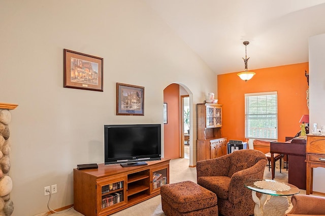 1 Cherry Ct, Clancy, MT 59634 - living area featuring arched walkways, light colored carpet, plenty of natural light, and vaulted ceiling