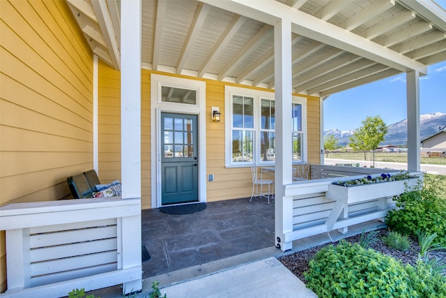 306 Mansion View Loop, Hamilton, MT 59840 - view of exterior entry with a porch and a mountain view