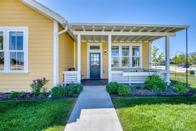 306 Mansion View Loop, Hamilton, MT 59840 - doorway to property featuring covered porch and a yard
