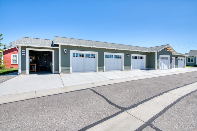 306 Mansion View Loop, Hamilton, MT 59840 - view of front facade with roof with shingles and community garages