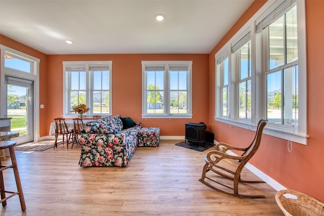 306 Mansion View Loop, Hamilton, MT 59840 - sitting room featuring baseboards, a wood stove, wood finished floors, and recessed lighting