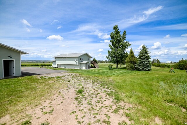 265 Fisher Rd, Great Falls, MT 59405 - view of grassy yard featuring stairs