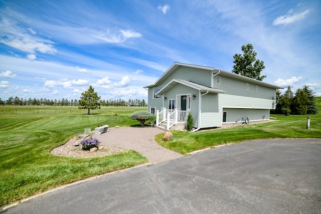 265 Fisher Rd, Great Falls, MT 59405 - view of side of home with a lawn and driveway