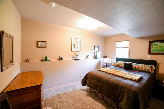 265 Fisher Rd, Great Falls, MT 59405 - carpeted bedroom featuring a textured ceiling and baseboards