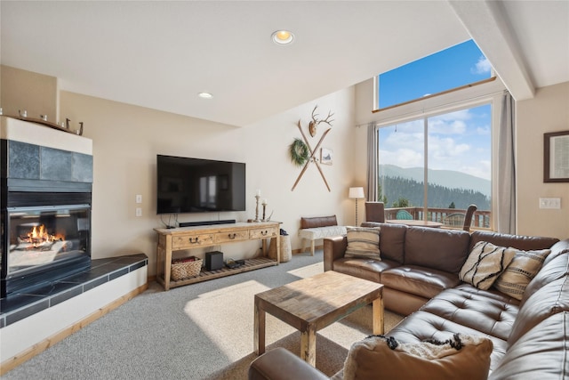 322 Wood Run Dr Unit B, Whitefish, MT 59937 - carpeted living area with a tiled fireplace and recessed lighting