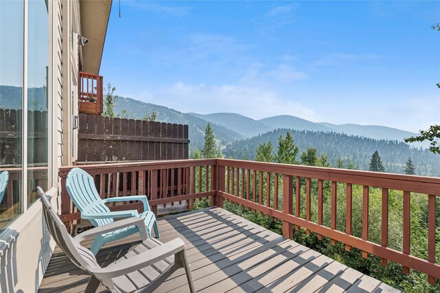 322 Wood Run Dr Unit B, Whitefish, MT 59937 - wooden terrace with a mountain view