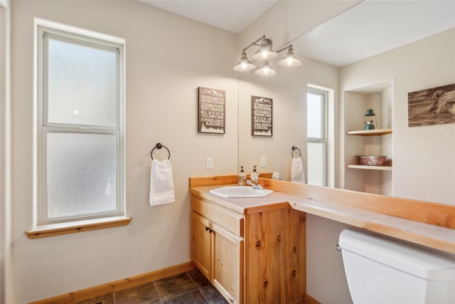 322 Wood Run Dr Unit B, Whitefish, MT 59937 - bathroom featuring vanity, toilet, and baseboards