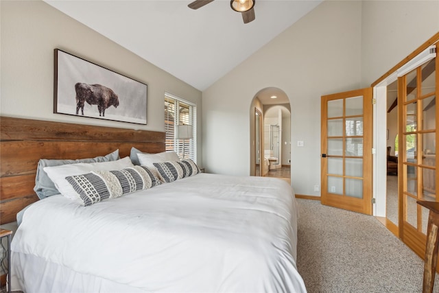 322 Wood Run Dr Unit B, Whitefish, MT 59937 - carpeted bedroom with arched walkways, high vaulted ceiling, ceiling fan, and baseboards
